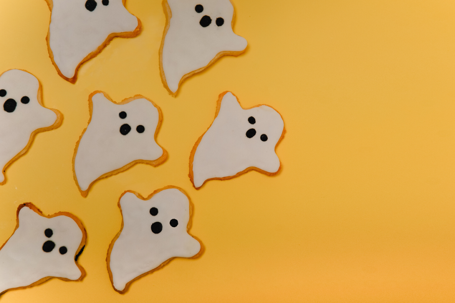 Small cartoon ghost icons on a yellow background